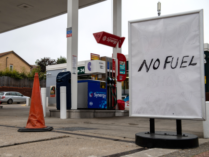 LONDON, ENGLAND - SEPTEMBER 25: A sign outside an Esso garage informing the public that they have no fuel on September 25, 2021 in Catford, London, United Kingdom. BP and Esso have announced that its ability to transport fuel from refineries to its branded petrol station forecourts is being impacted …