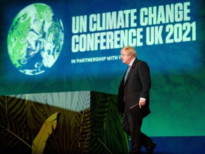 British Prime Minister Boris Johnson walks out to speak at the Action on Forests and Land Use session, during the COP26 UN Climate Change Conference in the Scottish city of Glasgow on November 2, 2021. - World leaders meeting at the COP26 climate summit in Glasgow will issue a multibillion-dollar …