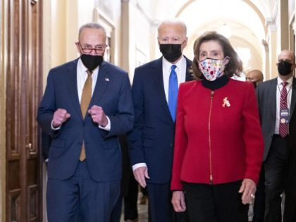 JANUARY 6: President Joe Biden is escorted into the Capitol by Senate Majority Leader Chuc