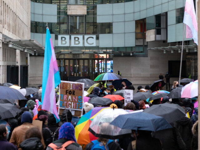 LONDON, UNITED KINGDOM - 2022/01/08: Protestors gather outside the BBC building during the demonstration. Organized by Trans Activism UK, transgender rights supporters gathered outside BBC's office at Portland Place to protest against the news corporation's queerphobic agenda. Earlier in October 2021, the BBC published an article titled 'We're being pressured …