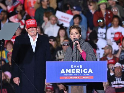 Former US President Donald Trump and Kari Lake, whom Trump is supporting in the Arizona's gubernatorial race, speak during a rally at the Canyon Moon Ranch festival grounds in Florence, Arizona, southeast of Phoenix, on January 15, 2022, - Thousands of Donald Trump supporters gathered in Arizona on Saturday to …