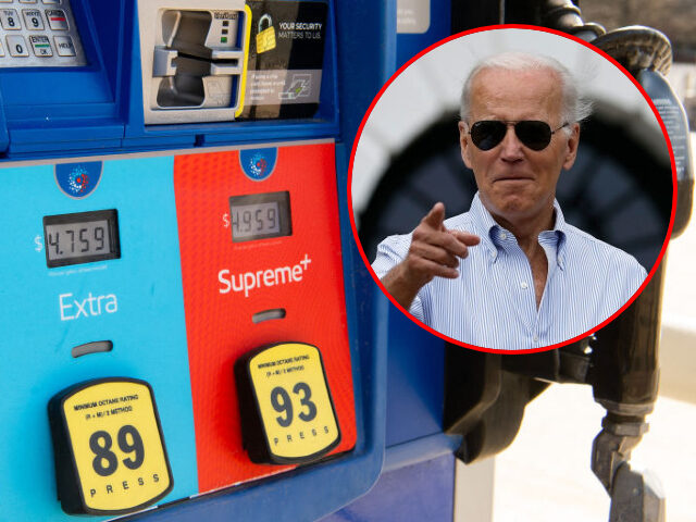 A gas pump displays current fuel prices, along with a sticker of US President Joe Biden, a