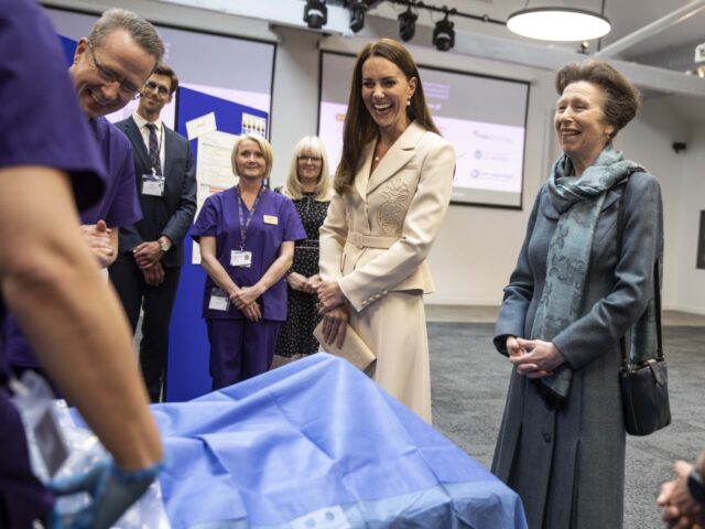LONDON, ENGLAND - APRIL 27: Princess Anne, The Princess Royal, Patron of the Royal College of Midwives (RCM), and Catherine, Duchess of Cambridge, Patron of the Royal College of Obstetricians and Gynaecologists (RCOG), watch a demonstration of a mock emergency caesarian operation by Dr Katie Cornthwaite using a dummy during …
