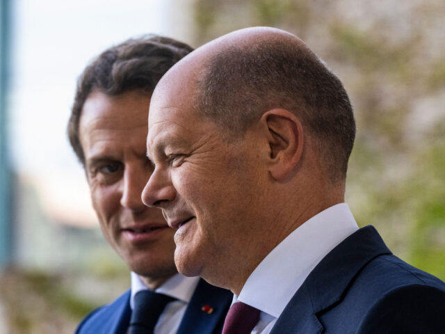 German Chancellor Olaf Scholz (R) welcomes French President Emmanuel Macron as he arrives for talks at the Chancellery in Berlin on May 9, 2022. (Photo by John MACDOUGALL / AFP) (Photo by JOHN MACDOUGALL/AFP via Getty Images)