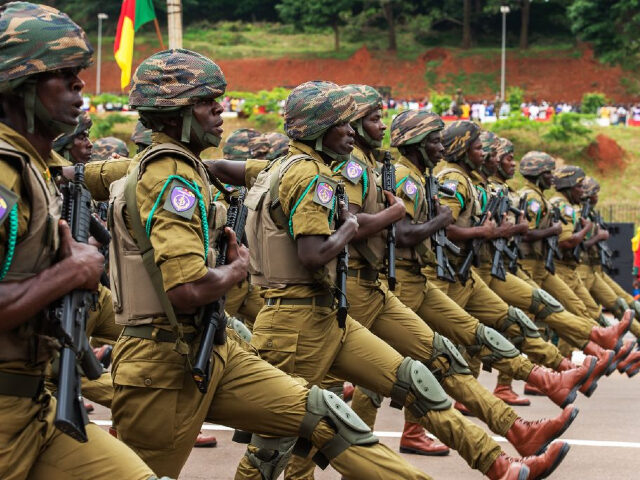 Soldiers take part in a parade to celebrate the National Day in Yaounde, Cameroon, on May