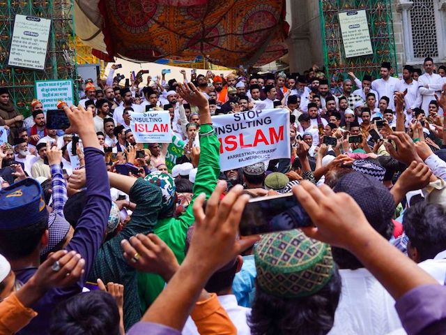 Muslims hold placards during a silent demonstration to protest against India's Bharatiya Janata Party former spokeswoman Nupur Sharma over her incendiary remarks about Prophet Mohammed, in Ajmer on June 17, 2022. (Photo by Himanshu SHARMA / AFP) (Photo by HIMANSHU SHARMA/AFP via Getty Images)