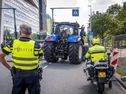 Farmers leave on their tractors after a protest against the cabinet's proposed nitrogen po