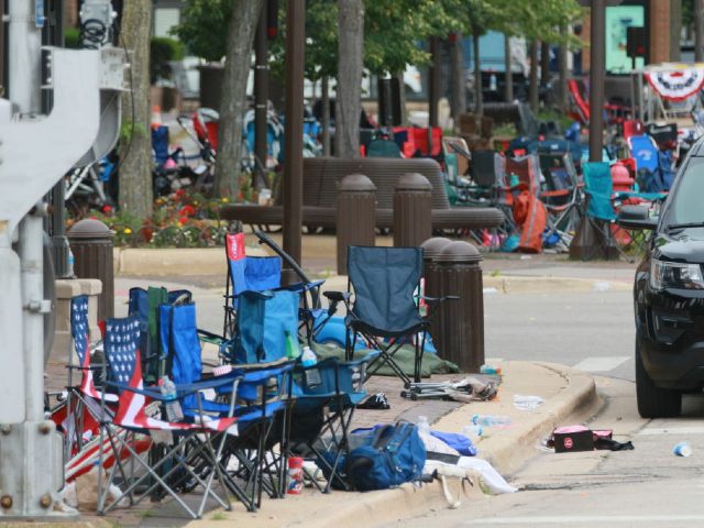 HIGHLAND PARK, ILLINOIS - JULY 04: Belongings are shown left behind at the scene of a mass shooting along the route of a Fourth of July parade on July 4, 2022 in Highland Park, Illinois. Police have detained Robert “Bobby” E. Crimo III, 22, in connection with the shooting in …
