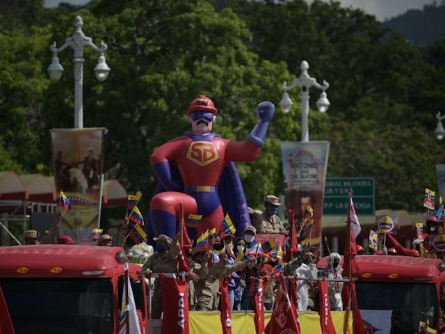 An inflatable doll of "Super Mustache", a comics character depicting Venezuelan President Nicolas Maduro, is seen during a military parade to celebrate the 211th anniversary of the Venezuelan Independence in Caracas, on July 5, 2022. (Photo by Federico PARRA / AFP) (Photo by FEDERICO PARRA/AFP via Getty Images)