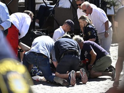 Police and rescue services give medical aid to a woman who has been seriously injured in a stabbing at the Almedalen political festival in Visby on the Swedish island of Gotland on July 6, 2022. - A man suspected for the crime has been arrested by the police. - Sweden …