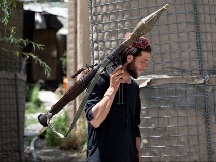 In this photograph taken on July 8, 2022, a Taliban fighter carries a rocket-propelled grenade (RPG) at a road checkpoint near the Bazarak district in Panjshir Province. (Photo by Wakil KOHSAR / AFP) (Photo by WAKIL KOHSAR/AFP via Getty Images)