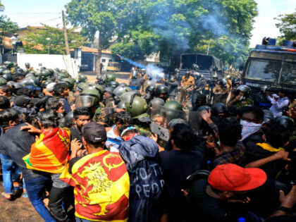 Sri Lankan police fire tear gas as anti-government protesters try to go through STF police in front of prime minister's office, Colombo, Sri Lanka. 13 July 2022 (Photo by Tharaka Basnayaka/NurPhoto via Getty Images)