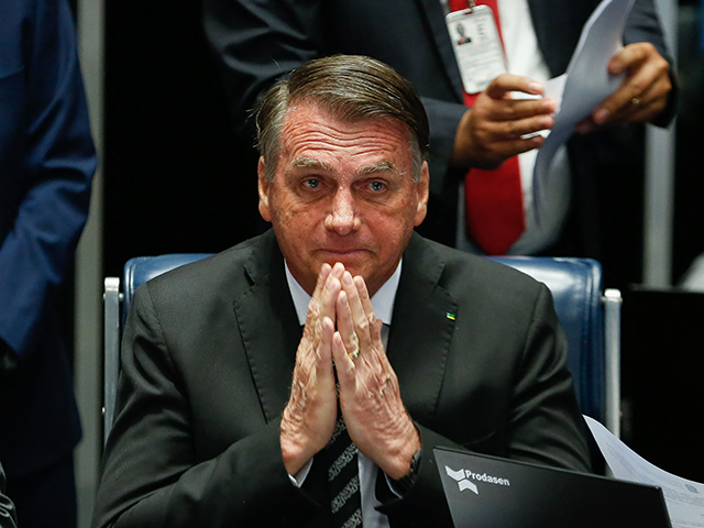 Brazilian President Jair Bolsonaro gestures during a session of the National Congress to e