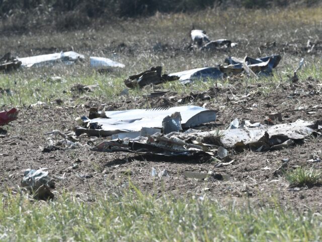This picture taken on July 17, 2022, shows debris on the crash site of an Antonov An-12 ca