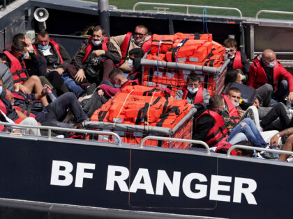 A group of people thought to be migrants are brought in to Dover, Kent, onboard a Border Force vessel following a small boat incident in the Channel. Picture date: Monday July 18, 2022. (Photo by Gareth Fuller/PA Images via Getty Images)