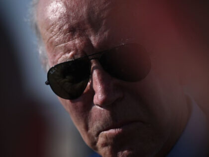 US President Joe Biden speaks to members of the media after disembarking Air Force One at