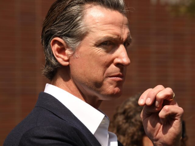 SANTA MONICA, CA - JULY 22, 2022 - - Gov. Gavin Newsom listens to speakers before signing Senate Bill 1327, for gun legislation modeled after Texas abortion ban, into law by at Santa Monica College on July 22, 2022. State Senators Bob Hertzberg and Anthony Portantino, are authors of the …