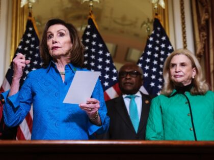 WASHINGTON, DC - MARCH 17: (L-R) Rep. Brenda Lawrence (D-MI), Speaker of the House Nancy Pelosi (D-CA), Rep. James Clyburn (D-SC) and Rep. Carolyn Maloney (D-NY) participate in a bill enrollment ceremony for the Postal Service Reform Act, H.R. 3076, at the U.S. Capitol on March 17, 2022 in Washington, …