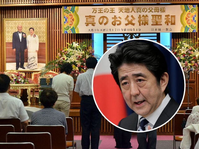 Unification Church followers gather to mourn the death of their leader Sun Myung Moon (pictured back R) at their church in Tokyo on September 4, 2012. Some 1,000 believers visited the church to mourn of church's founder who died at the age of 92 on September 3 in Seoul after …