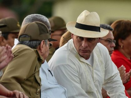 Cuban president Raul Castro (L) and Cuban First Vice President Miguel Diaz-Canel (R) talk during the celebration of the 64th anniversary of the guerrilla assault to the Moncada Barracks, widely regarded as the beginning of the Cuban Revolution, in Pinar del Rio Province, on July 26, 2017. / AFP PHOTO …