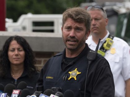 Lake County sergeant Christopher Covelli speaks at the scene of the Fourth of July parade shooting in Highland Park, Illinois on July 4, 2022. - A shooter opened fire Monday during a parade to mark US Independence Day in the state of Illinois, killing at least six people, officials said. …