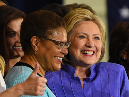 Democratic presidential candidate Hillary Clinton (C) is flanked by Rep. Karen Bass (D-Calif), L, and Rep. Maxine Waters (D-Calif), R, during a Women for Hillary organizing event at West Los Angeles College on June 3, 2016, in Culver City, California. (ROBYN BECK/AFP via Getty Images)