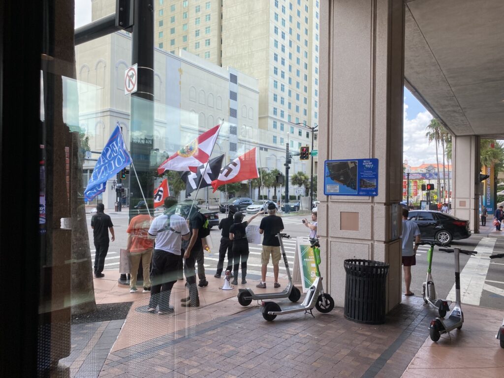Protesters dressed as neo-Nazis outside Turning Point USA's Student Action Summit in Tampa, Florida. (Alana Mastrangelo/Breitbart News)