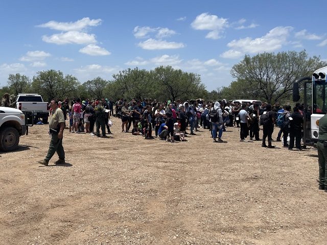 Eagle Pass Station Border Patrol agents apprehend a large group of nearly 400 migrants on July 5. (Randy Clark/Breitbart Texas)