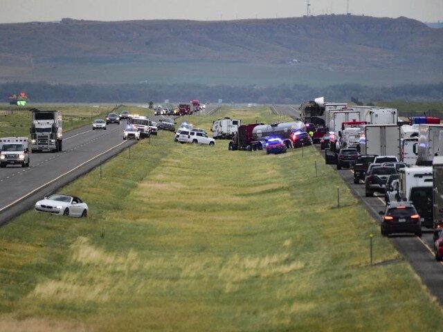 First responders work the scene on Interstate 90 after a fatal pileup where at least 20 ve