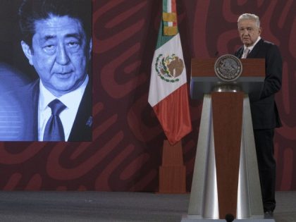 A photo of Japanese Prime Minister Shinzo Abe is displayed on the screen as Mexican President Andres Manuel Lopez Obrador offers his condolences following his death during his daily press conference at the National Palace in Mexico City, Friday, July 8, 2022. Former Prime Minister Shinzo Abe was assassinated Friday, …