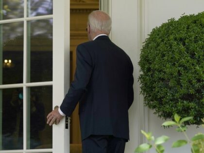 President Joe Biden walks into the Oval Office of the White House in Washington, Wednesday, July 27, 2022, as he returns to work in the Oval Office after recovering from COVID-19. (Susan Walsh/AP)