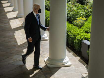 US President Joe Biden walks along the colonnade from the residence to speak in the Rose Garden of the White House in Washington, D.C., US, on Wednesday, July 27, 2022. Biden ended his isolation after twice testing negative for Covid-19 capping his first bout with a virus that the White …
