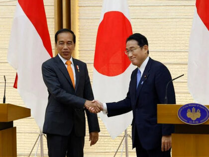Joko Widodo, Indonesia's president, left, shakes hands with Fumio Kishida, Japan's prime minister, as they conclude a joint news conference at the prime minister's official residence in Tokyo, Japan, on Wednesday, July 27, 2022. The upcoming G-20 summit presents Jokowi with a diplomatic balancing act in the wake of Russias …