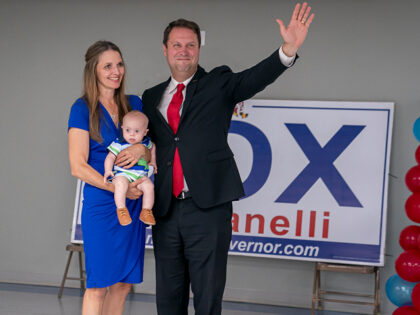 EMMITSBURG, MD - JULY 19: Dan Cox, a candidate for the Republican gubernatorial nomination, and his wife Valerie Cox react to their primary win on July 19, 2022 in Emmitsburg, Maryland. Voters will choose candidates during the primary for governor and seats in the House of Representatives in the upcoming …