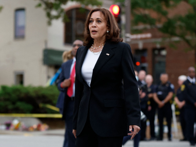 US Vice President Kamala Harris reacts as she arrives to visit the site of a shooting whic