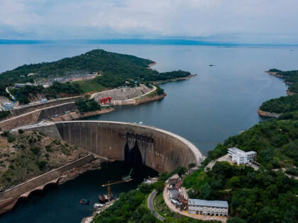 An aerial view shows the Kariba Dam and the Kariba lake in Kariba on January 20, 2020. From the Zambian side the plant is managed by ZESCO, a state-owned power company. - In the absence of sufficient rain, the Kariba dam, the main source of electricity for Zambia and Zimbabwe, …