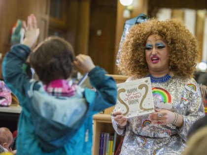 In this Saturday, May 13, 2017 photo, Lil Miss Hot Mess reads to children during the Feminist Press' presentation of Drag Queen Story Hour! at the Park Slope Branch of the Brooklyn Public Library, in New York. (Mary Altaffer/AP)