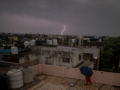 NEW DELHI, INDIA - MAY 23: A view of lightning seen from a rooftop at Patel Nagar on May 23, 2022 in New Delhi, India. Several parts of Delhi-NCR received rains with gusty winds in Delhi as the temperatures dropped by ten degrees. The downpour led to several trees being …
