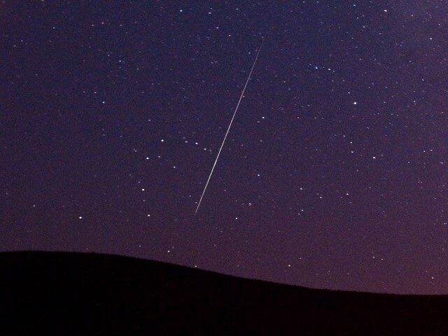 A Perseid meteor streaks across the sky during the Perseid meteor shower on Tuesday, Aug. 11, 2009, in Vinton, Calif. (Kevin Clifford/AP)