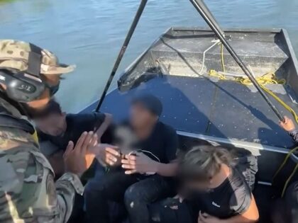 Eagle Pass Marine Unit agents rescue four adult migrants trapped overnight in the Rio Grande. (U.S. Border Patrol/Del Rio Sector)