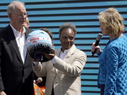 NASCAR CEO Jim France, left, and Executive Vice President Lesa Kennedy, right, present Chi