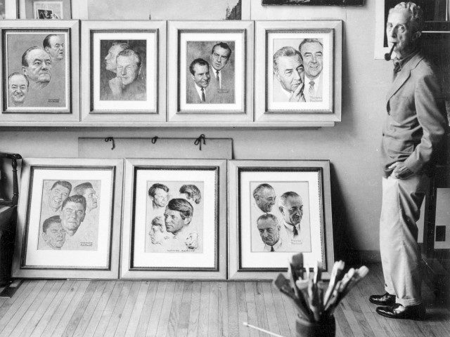 Norman Rockwell stands beside some of his famous paintings in 1969. (Getty)