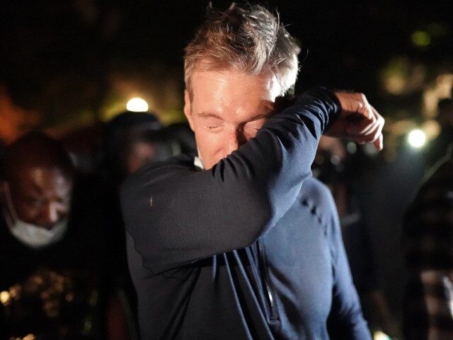 PORTLAND, OR - JULY 22: Portland Mayor Ted Wheeler reacts after being exposed to tear gas fired by federal officers while attending a protest against police brutality and racial injustice in front of the Mark O. Hatfield U.S. Courthouse on July 22, 2020 in Portland, Oregon. State and city elected …