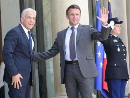 Israeli Prime Minister Yair Lapid on Tuesday told French President Emmanuel Macron the "world must respond" to Iran's malign nuclear activities, in the new Israeli premier's first diplomatic visit since the Knesset dispersed in a dramatic showdown last week.