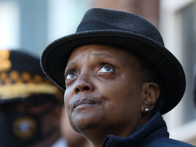 Mayor Lori Lightfoot holds a news conference about a tip line for residents to help solve homicides on Oct. 30, 2021, in Chicago. The news conference took place in front of a building where a 4-year old was killed. (Chicago Tribune / Contributor via Getty)