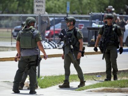 Law enforcement personnel stand outside Robb Elementary School following a shooting, Tuesday, May 24, 2022, in Uvalde, Texas. (Dario Lopez-Mills/AP)