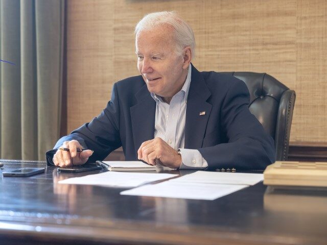 In this image provided by the White House, President Joe Biden speaks with Sen. Bob Casey, D-Pa., on the phone from the Treaty Room in the residence of the White House Thursday, July 21, 2022, in Washington. Biden says he's "doing great" after testing positive for COVID-19. The White House …