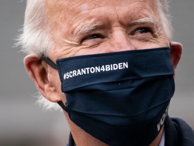 SCRANTON, PA - NOVEMBER 03: Democratic presidential nominee Joe Biden wears a "Scranton For Biden" face mask as he visits his childhood home on November 03, 2020 in Scranton, Pennsylvania. As polls open on Election Day, nearly 100 million Americans have already cast their ballots through early voting and mail-in …