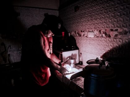 A man lights a candle during a blackout in Havana, on May 25, 2022. - The main thermoelect