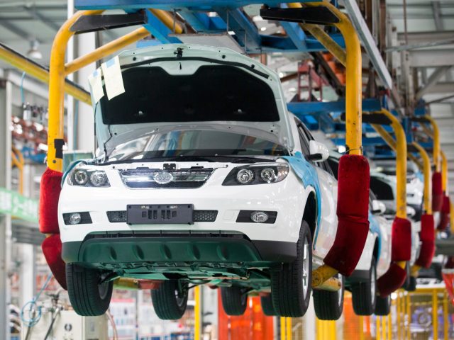 BYD Co. S6 sport-utility vehicles (SUV) move along the production line at the company's assembly plant in the Pingshan district of Shenzhen, China, on Tuesday, Aug. 5, 2014. Net debt for BYD Co., the electric automaker partially owned by Warren Buffetts Berkshire Hathaway Inc., or interest-bearing borrowings minus cash and …